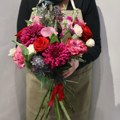 Peace and Joy  - A hand tied bouquet including , blooms , calls lilies, roses. Eustoma , stocks , and other flower mix . 